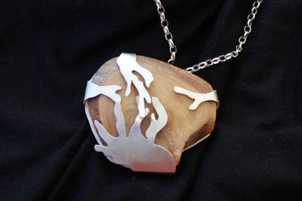 Encase. Pendant. Sterling silver setting with sandalwood. 